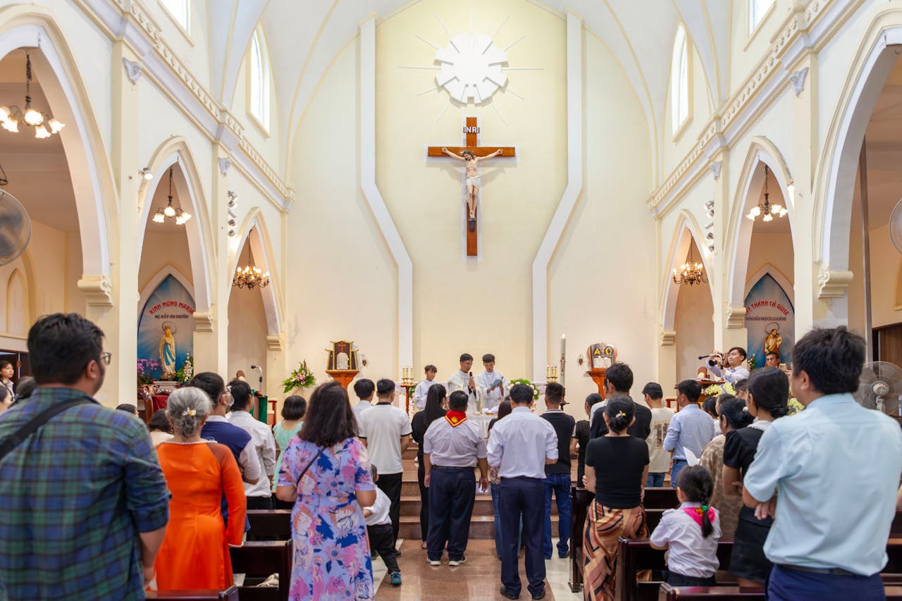 A diverse group of people attending a Christian church service with focus on altar.